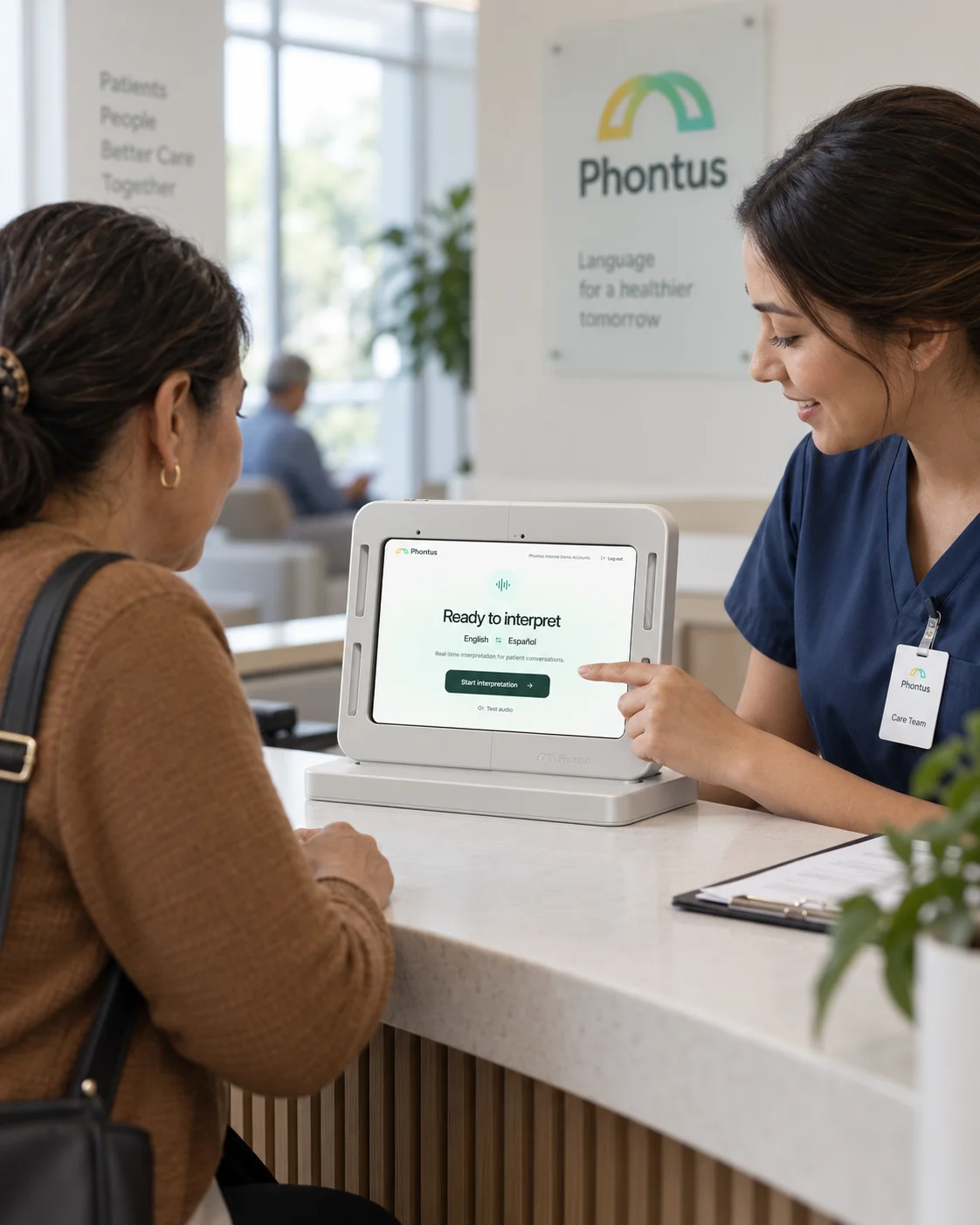 A staff member and visitor using a Phontus Interpreting Kit at a healthcare reception desk.